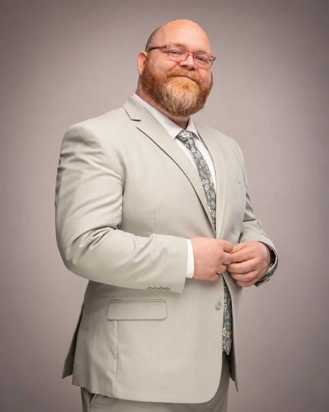 Brian Girton, licensed professional clinical counselor, in a sage suit